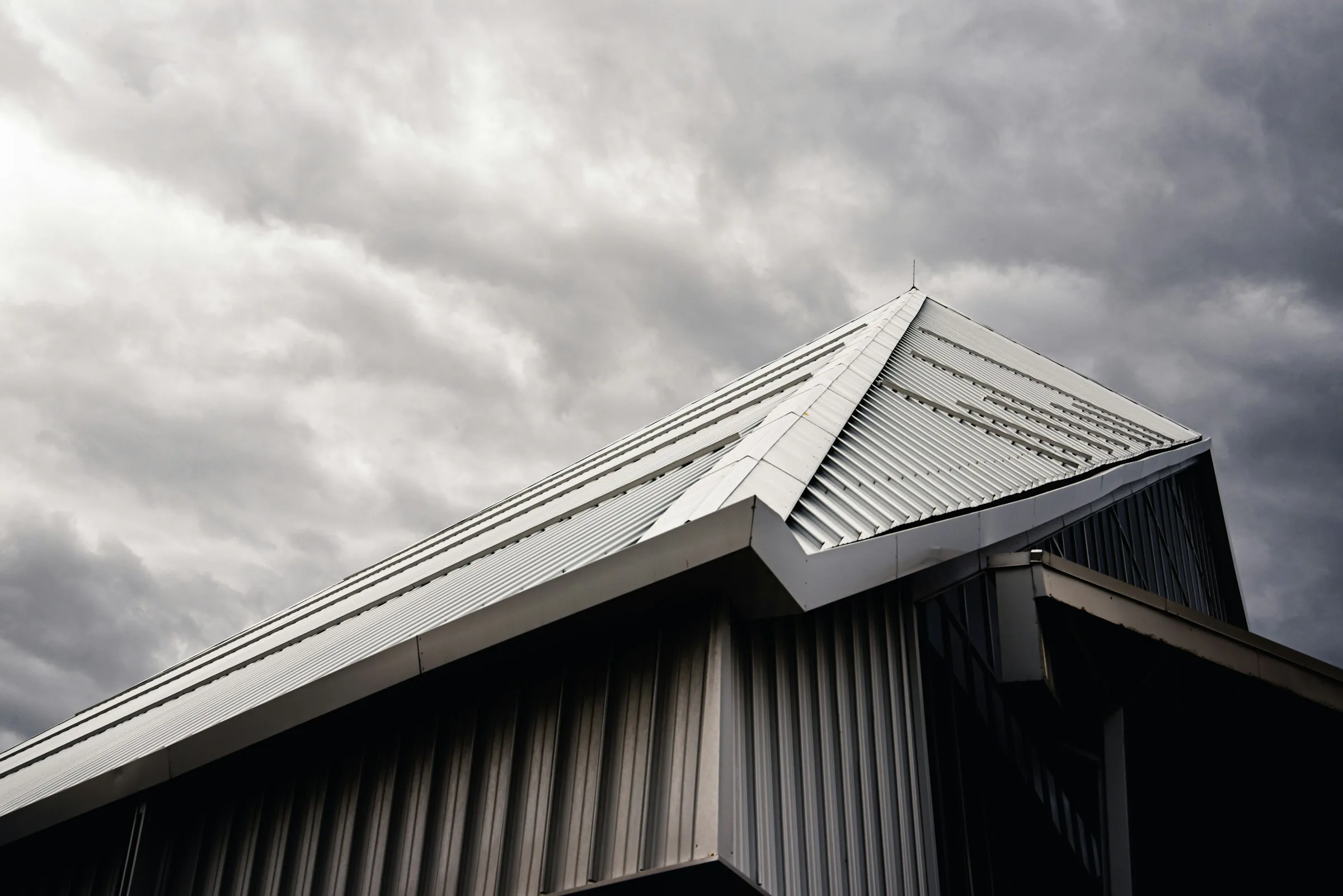 Illustrative gray metal roof with a dormer window